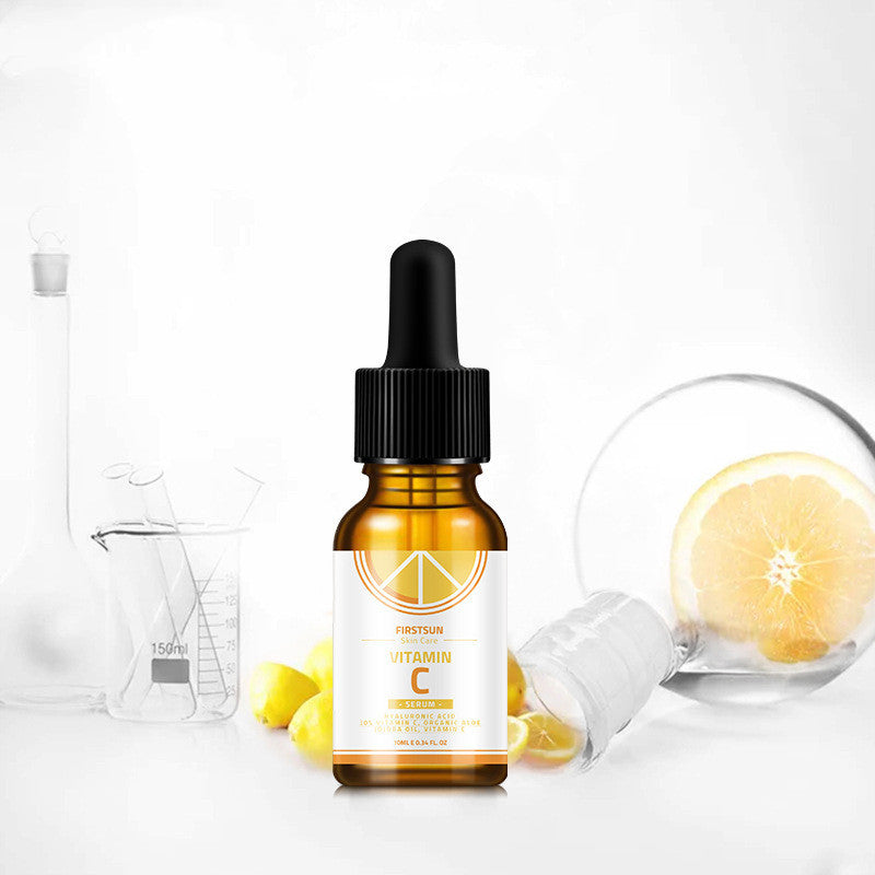 Glow Boost Vitamin C Serum by FirstSun 10ml amber dropper bottle with lemon imagery for moisturizing and whitening.